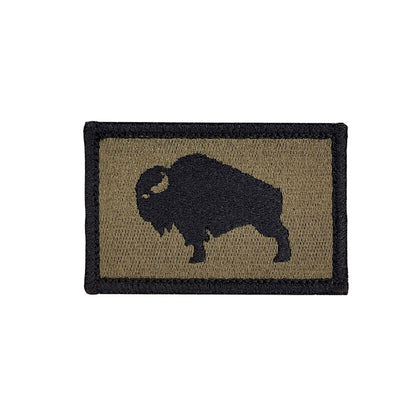 Patch with a black silhouette of a bison on a Olive Drab background


