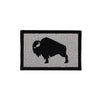 Patch with a black silhouette of a bison on a gray background